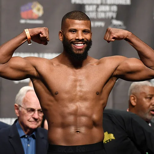 Badou Jack posing with his arms up showing his muscles