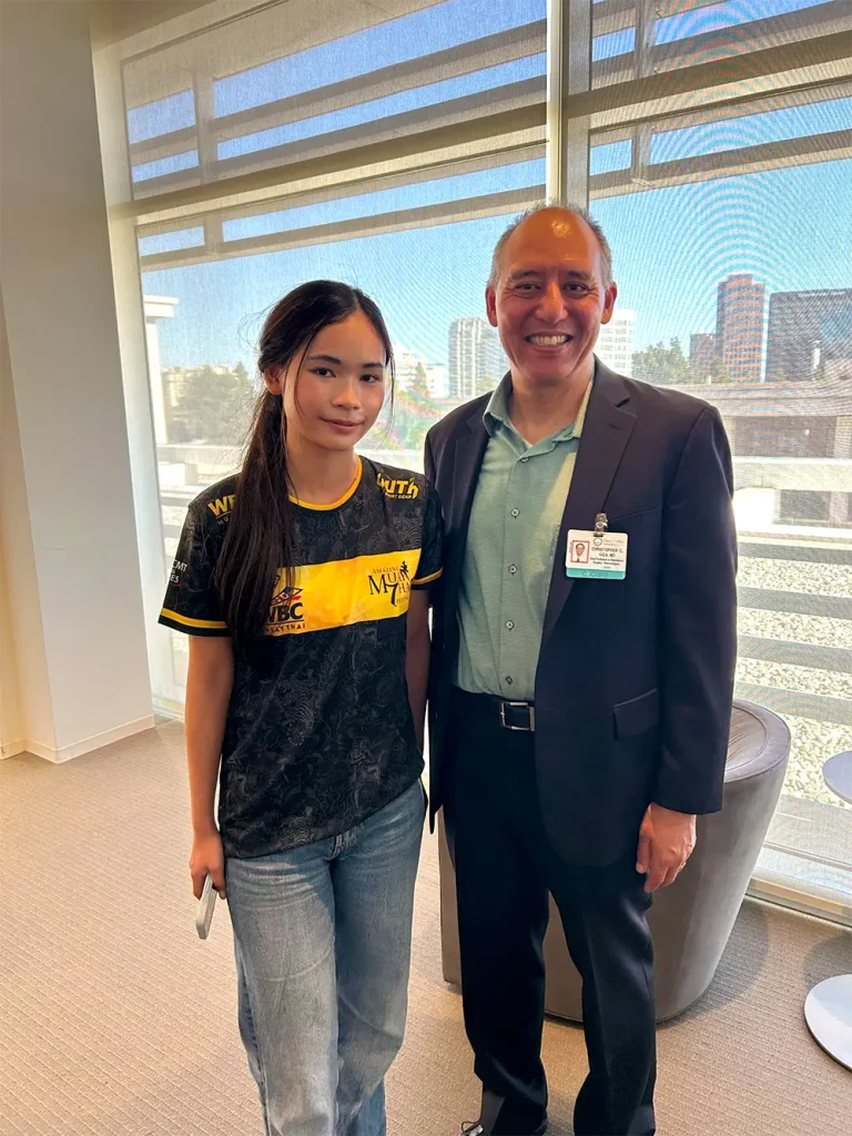 Dr Christopher Giza and Nabhiraks (Jade) Bhakdibhumi posing for the camera