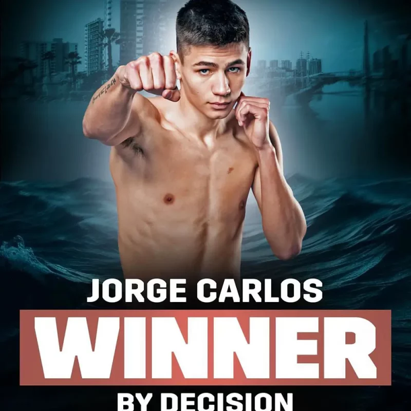 Jorge Carlos posing throwing a jab in a poster showcasing he won by decision