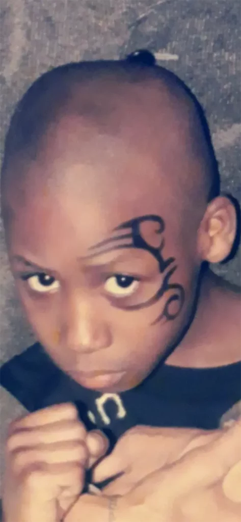 A very young Bruce 'Shu Shu' Carrington posing for the camera