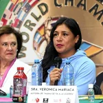 Speaker addressing the audience in an emotive talk at the "Champions against breast cancer" event