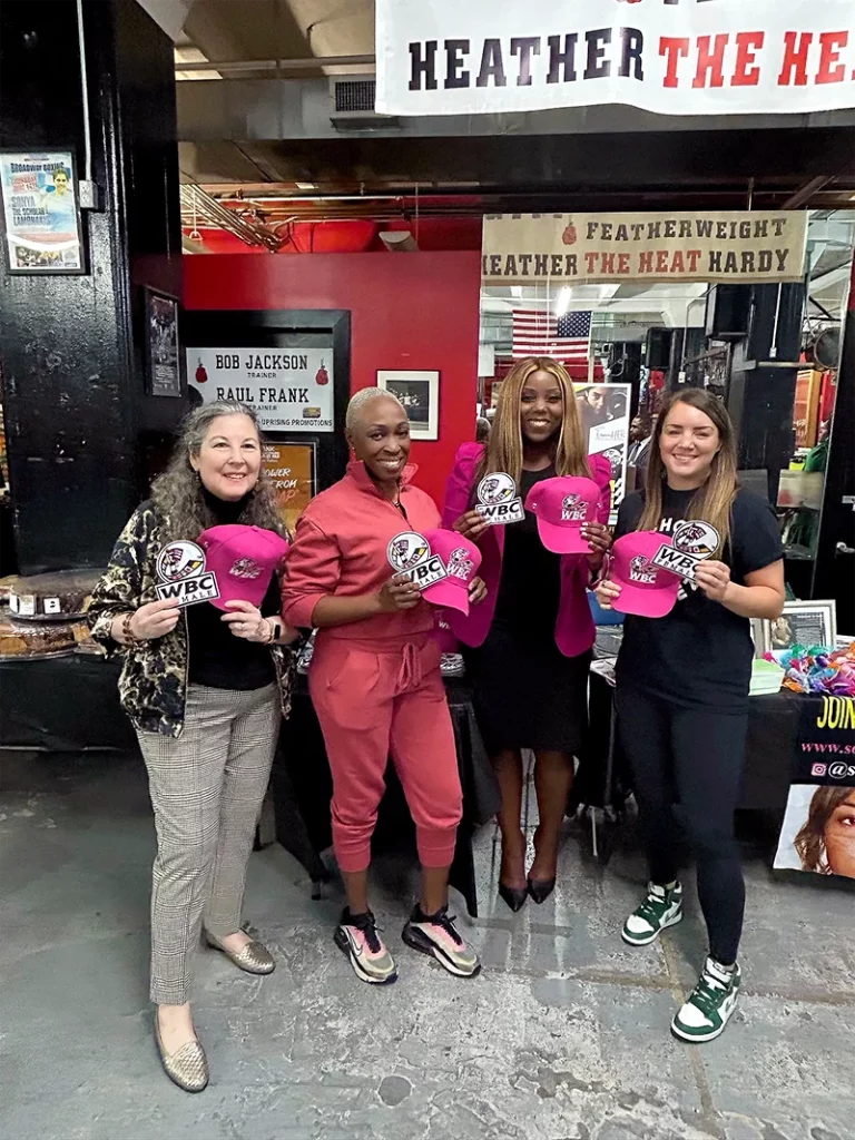 My Sister’s Keeper and Solve the Silence members at Gleason’s Gym event posing for the camera
