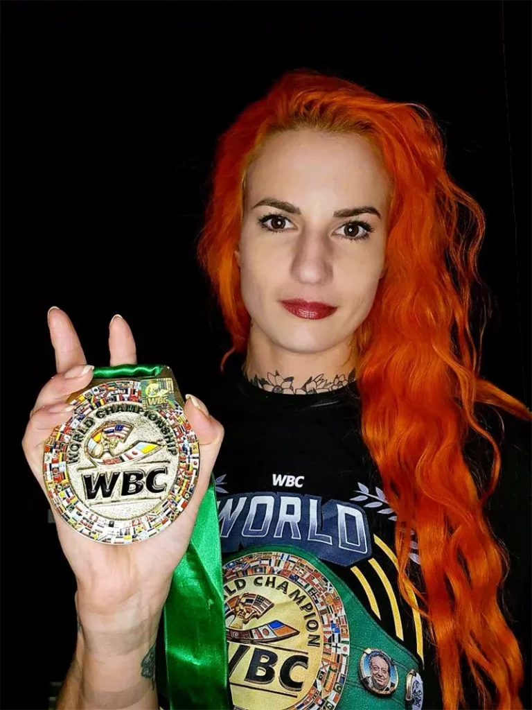 Katia Bissonnette posing with a WBC medal