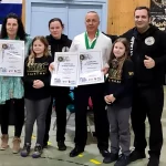Alessandro Sorce, Wolfgang Möger, Monika Vasileva and other members of the Saarbrücken School team posing with the donation check.