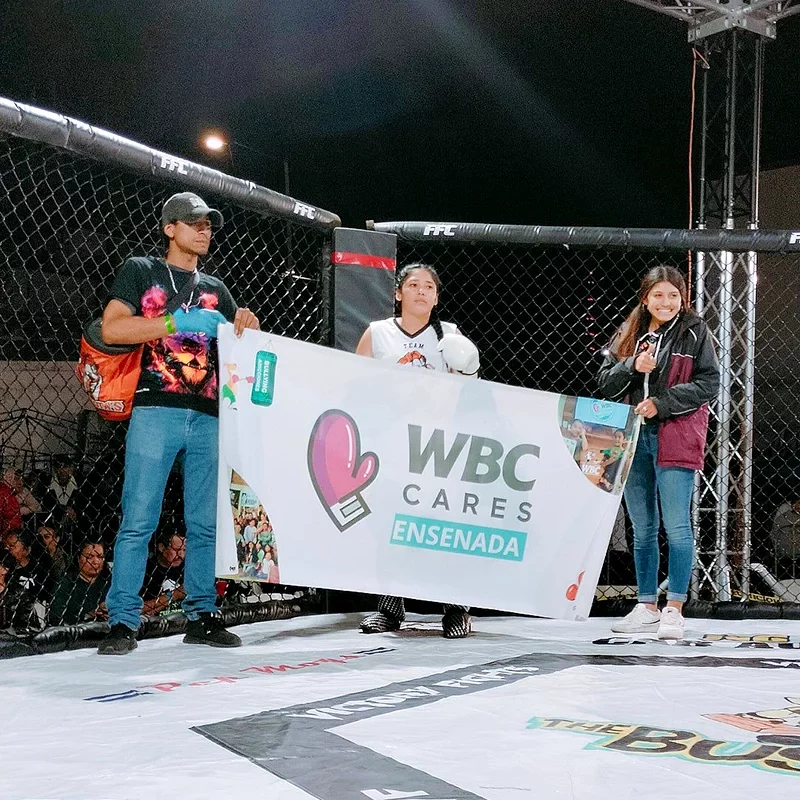 Some of the participants at the WBC Cares Ensenada chapter holding a WBC Cares banner